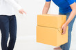 Woman receiving package from delivery man - put it down