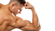 © blackday - Young muscular man showing his bicep