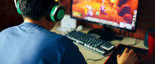 Young Man Playing Game On Computer, Banner