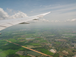 The top view from a window of the flying plane, background for travel holiday trip summer.