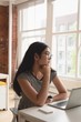 © Wavebreak Media - Thoughtful Young businesswoman sitting in office