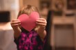 © Wavebreak Media - Girl holding heart shape decoration