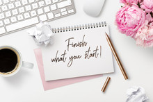 Finish What You Start - Business Concept. Notepad / Ring Binder, Crumpled Paper Balls, Mug With Coffee And Office Supplies On A White Feminine Styled Desktop, Top View