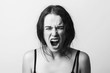 © Sergii - Angry screaming girl. Discontent, aggression, depression, attack, energy, cry, screaming. Black and White