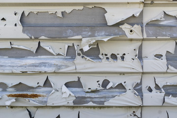 Metal wall with peeling paint