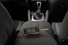 Key Lies Inside The Car's Interior On The Armrest