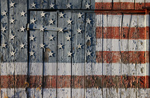 Detail Of Old Southern Maryland Tobacco Barn Dedicated To US Troops By Painting An American Flag On Barn With Cut Out Stars Attached 