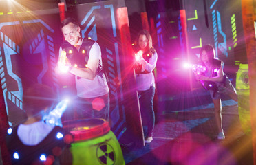 Sticker - Parents and children playing laser tag in beams