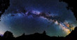 © Ivan Kurmyshov - Panoramic astrophotography of whole visible Milky Way galaxy. Silhouette of mountains. Stars, nebula and stardust at night sky landscape