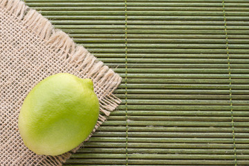 Wall Mural - lemon on sackcloth, top view