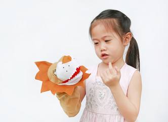 Wall Mural - Cute Little Asian child girl hand wear and playing Lion puppets on white background. Educations concept.