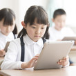 © amanaimages - タブレットPCを操作する小学生