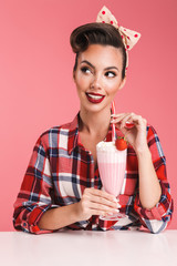 Poster - Portrait of a lovely brunette pin-up girl in plaid shirt