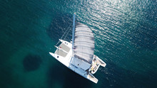 Aerial Drone Bird's Eye View Photo From Luxury Catamaran Docked At Tropical Deep Blue Sea
