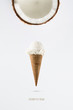 Coconut ice cream flavor in cones with fresh coconut setup on white background . Summer and Sweet menu concept.