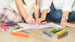 © pic for you - cute kid writing with kindergarten teacher,Back to school concept,Education toys for preschool and nursery.Parent and pupil of primary school.Beginning of lessons.
