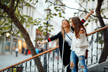 Sticker - Two young happy women in the city