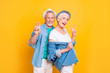 © deagreez - Hey hi hello what's up! Close up photo portrait of cheerful emotion expressing delightful funny funky pretty old lady and bearded stylish gentleman fooling around isolated on bright vivid background