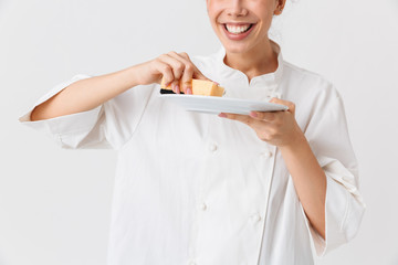 Wall Mural - Cropped image of a cheerful young woman cook