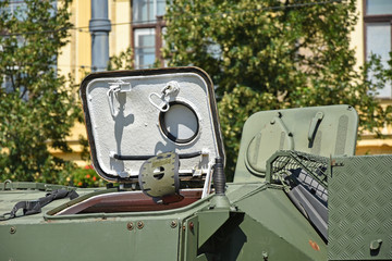 Part of an armoured military vehicle on the street