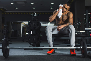 Wall Mural - Muscular bodybuilder rest after deadlifts at gym