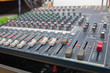 © phattaraphum - Closeup of the professional audio mixing console. Selective focus.