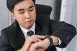 © geargodz - business man checking time on smart watch