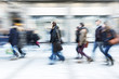 © FotoKachna - Large group of people walking in front of shop window, blue toned image