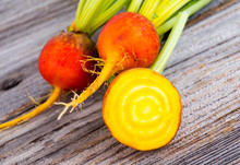 Golden Beets Raw On Rustic Wood Background