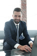 © ASDF - employee of the company typing text on the laptop keyboard