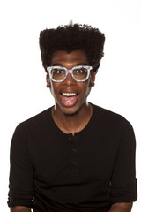 Wall Mural - Portrait of young happy african modern man with glasses on white background