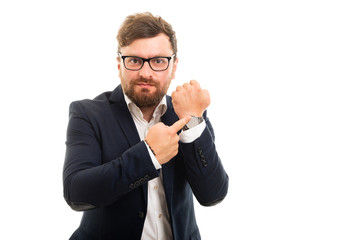 Wall Mural - Portrait of business man showing wrist watch.