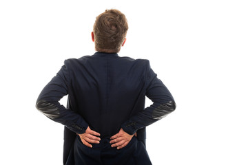 Wall Mural - Back view of business man showing back pain gesture.