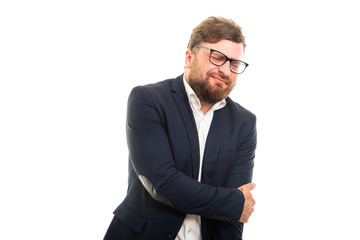Wall Mural - Portrait of business man showing elbow pain gesture.