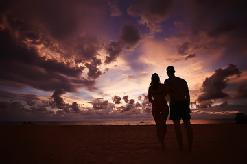 silhouette in love sunset sea / newlyweds in honeymoon at sea, vacation luck summer sea beach, silhouette couple at sunset