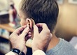 © Rawpixel.com - A man having his ears checked
