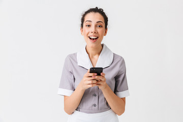 Wall Mural - Portrait of a cheerful young housemaid