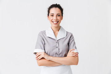 Wall Mural - Portrait of a cheerful young housemaid