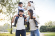 © Blue Jean Images - Cheerful young Chinese family playing outdoors