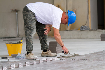 bricklayer at work in building site