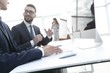 © ASDF - business colleagues sitting at their Desk