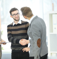 Wall Mural - handshake business colleagues at a meeting in the office