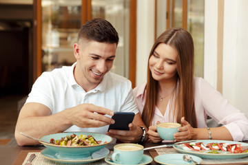 Wall Mural - Two people in cafe enjoying the time spending with each other