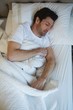 © Wavebreak Media - Man sleeping in bedroom