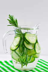 Cucumber and Rosemary Infused Water on wooden table