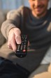 © Wavebreak Media - Man changing channel with remote control at home