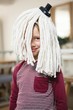 © Wavebreak Media - Happy boy with mop on head in kitchen