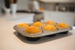 © Wavebreak Media - Muffins in baking tray at home