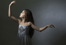 Portrait Of A Girl In A Dress Dancing