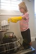 © Wavebreak Media - Boy arranging utensils in kitchen trolley